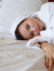 Berenice relaxes on her bed 
